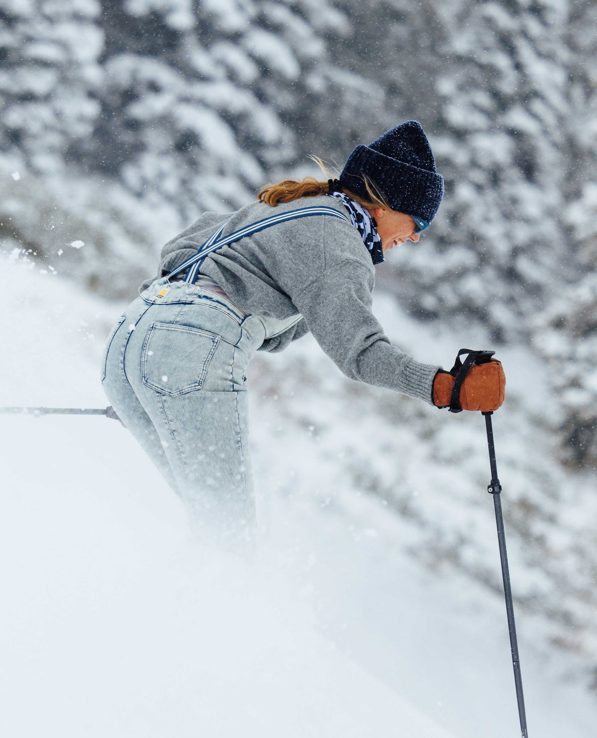 Person cross-country skiing in a snowy landscape with trees.