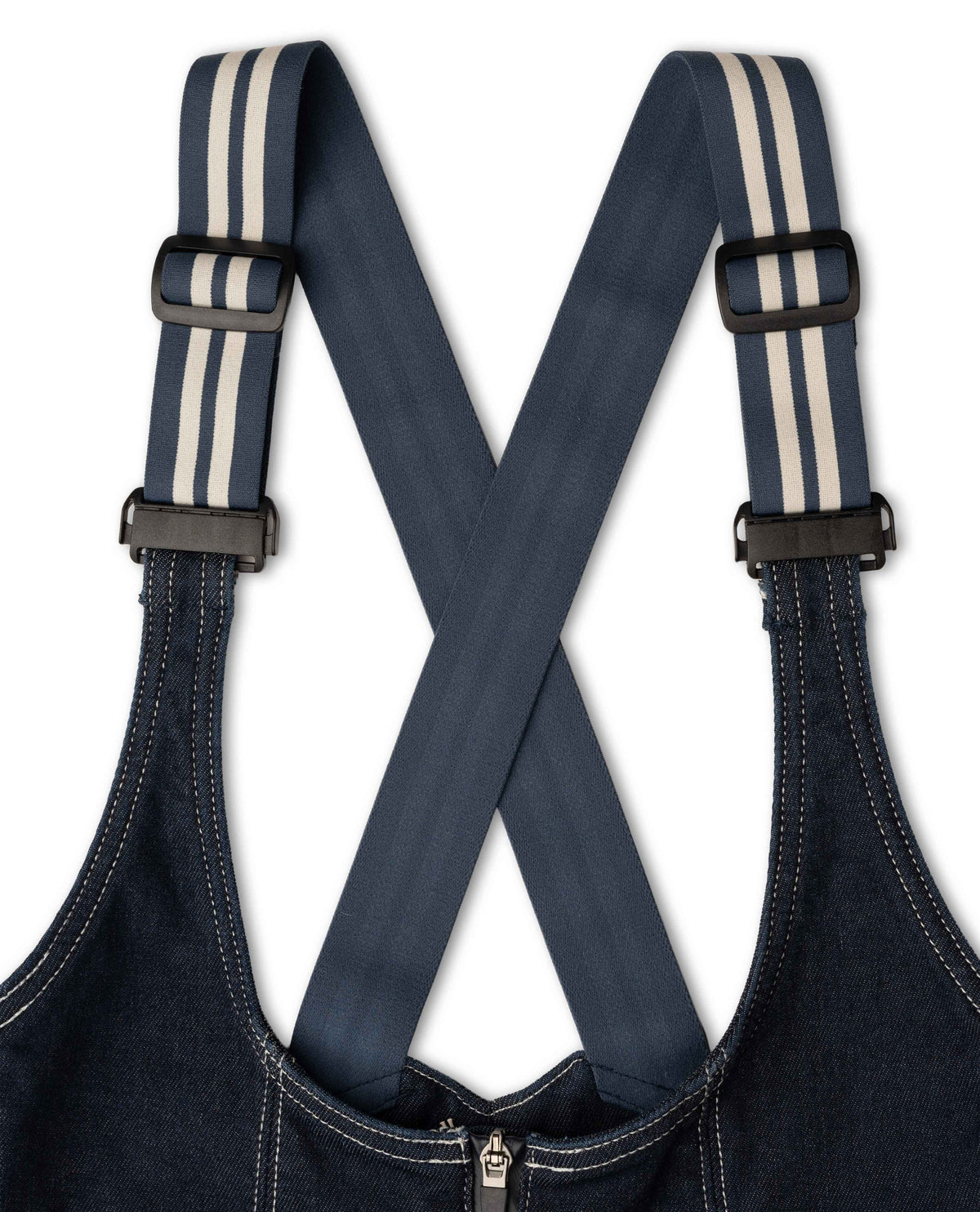 Dark blue denim overalls with striped suspenders on a white background