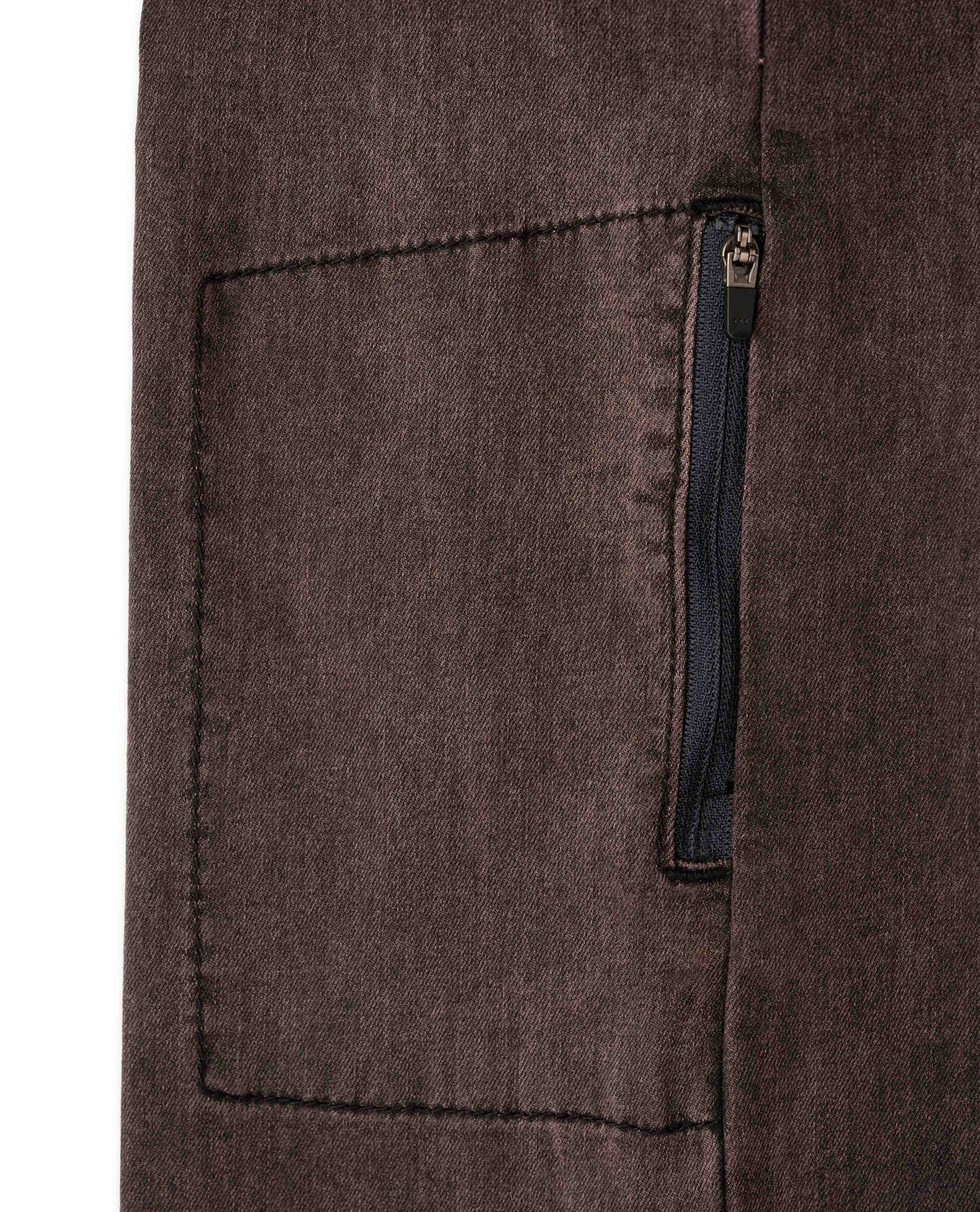 Close-up of a brown fabric pocket with a zipper on a white background
