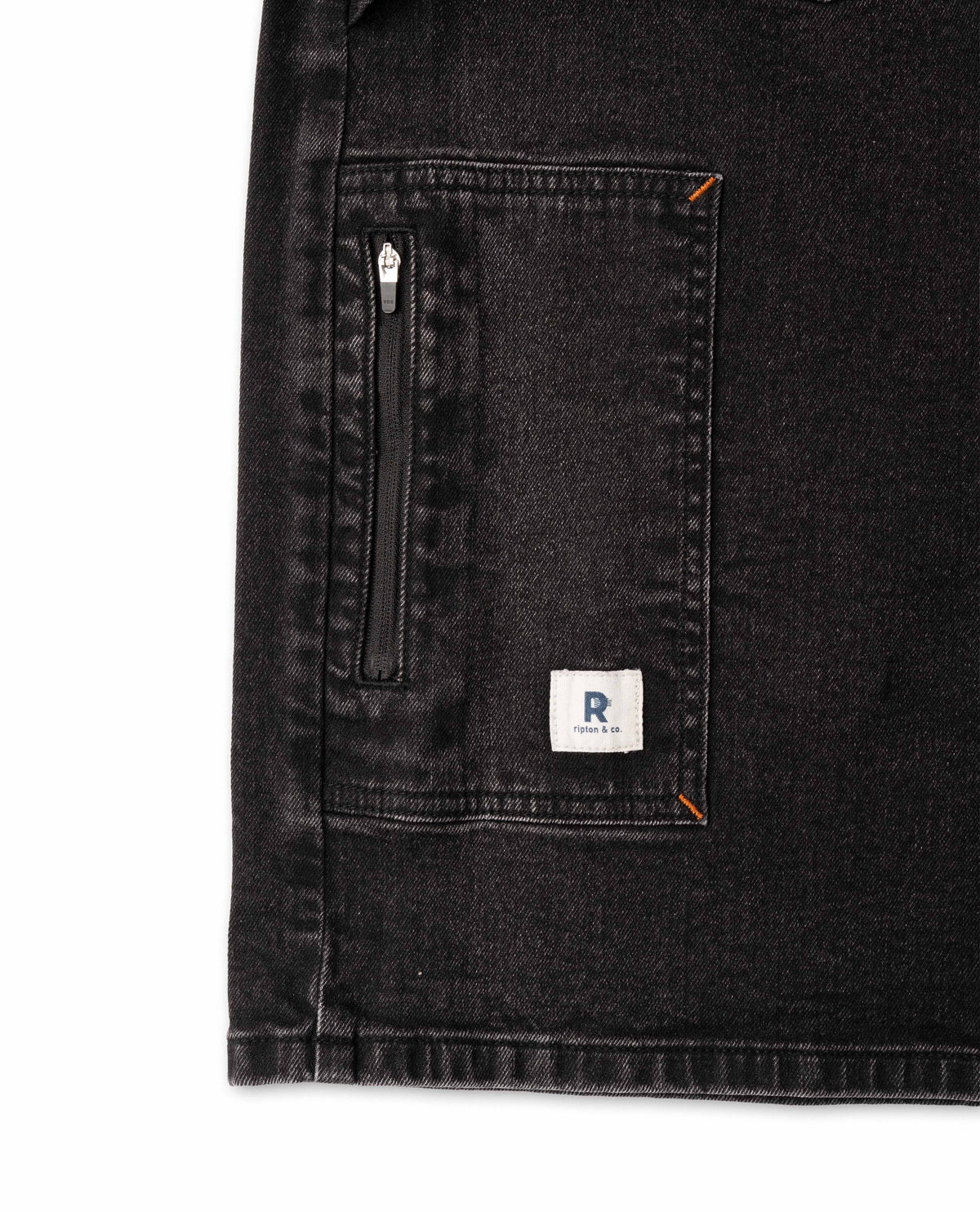Black denim jacket with a brand logo on a white background
