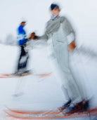 Two skiers on a snowy slope with blurred motion effect