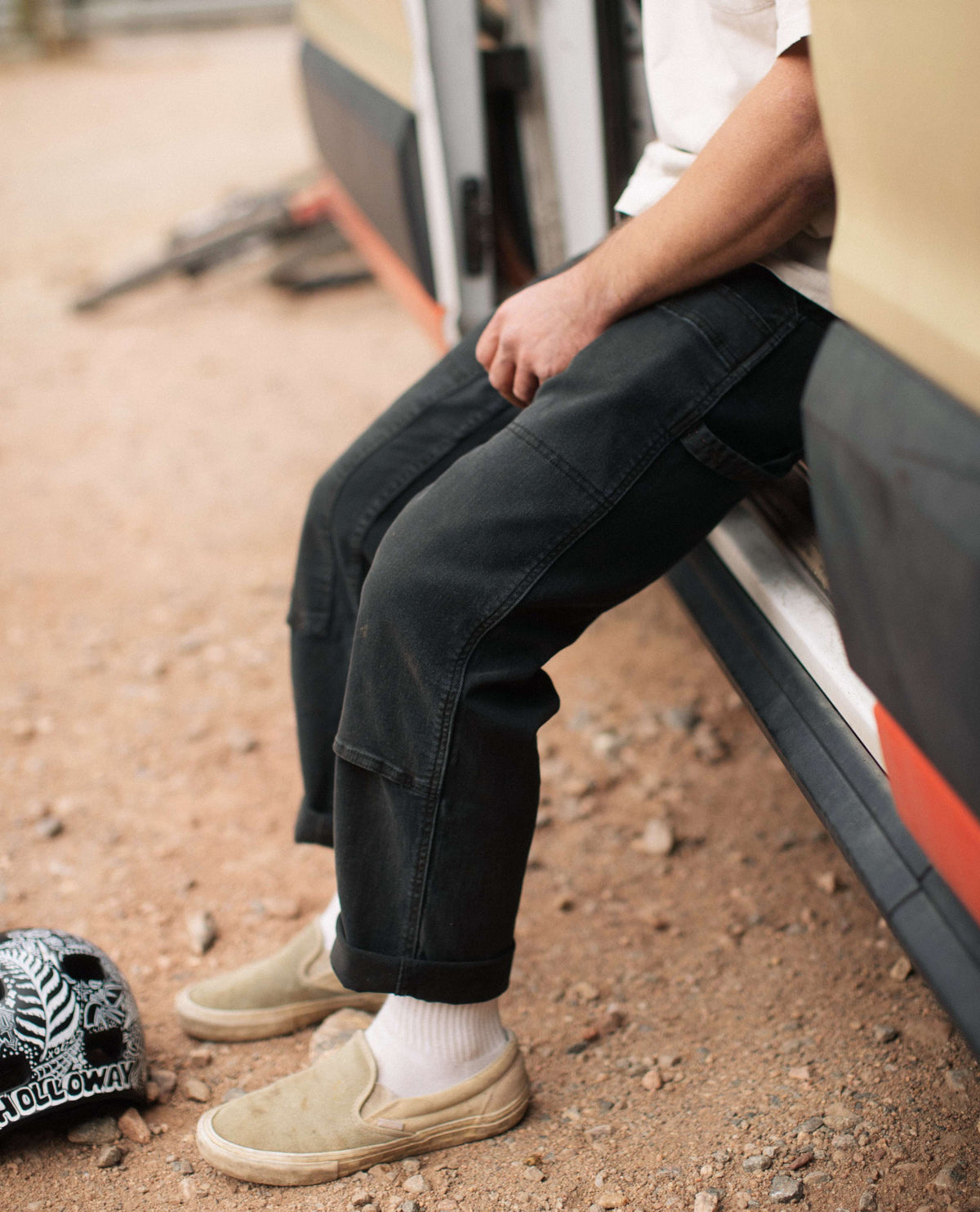 Black utility pants on callum sitting on the van
