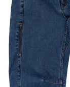 Close-up of blue denim jeans on a white background