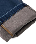 Close-up of a folded piece of clothing with blue and gray fabric.