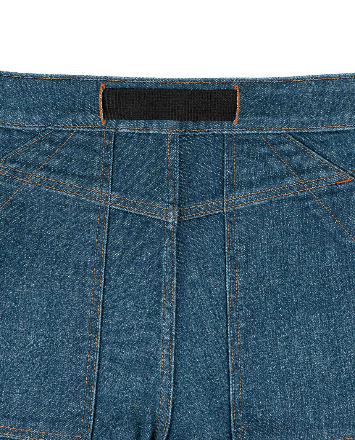Close-up of blue denim fabric with a black label.