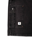 Black denim jacket with a brand logo on a white background
