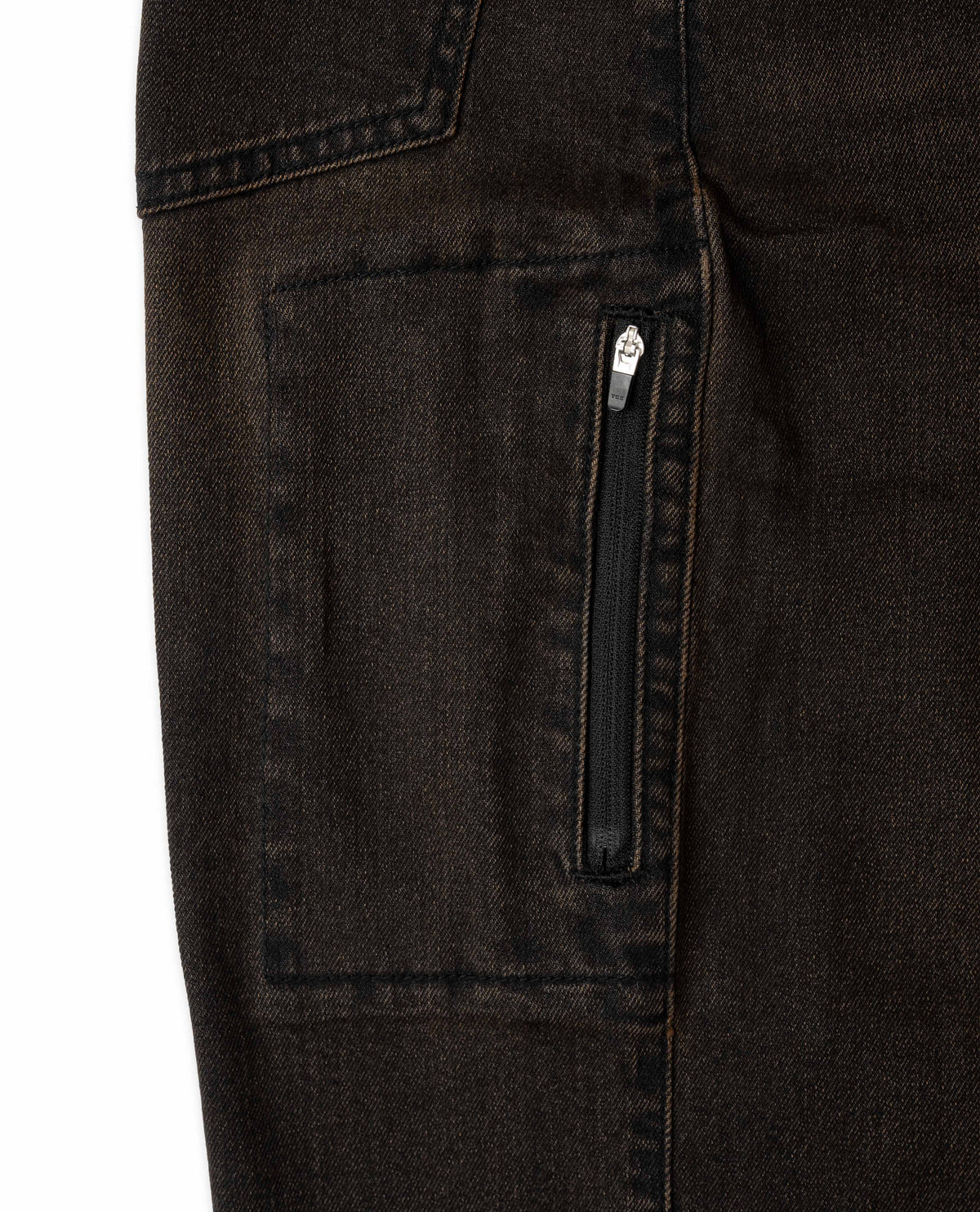 Close-up of dark jeans with a zipper pocket on a white background