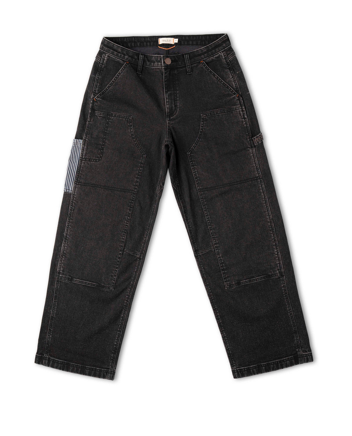 Black pants with patchwork design on a white background
