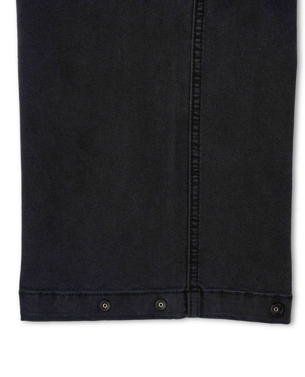 Close-up of a black denim jacket with button details on a white background