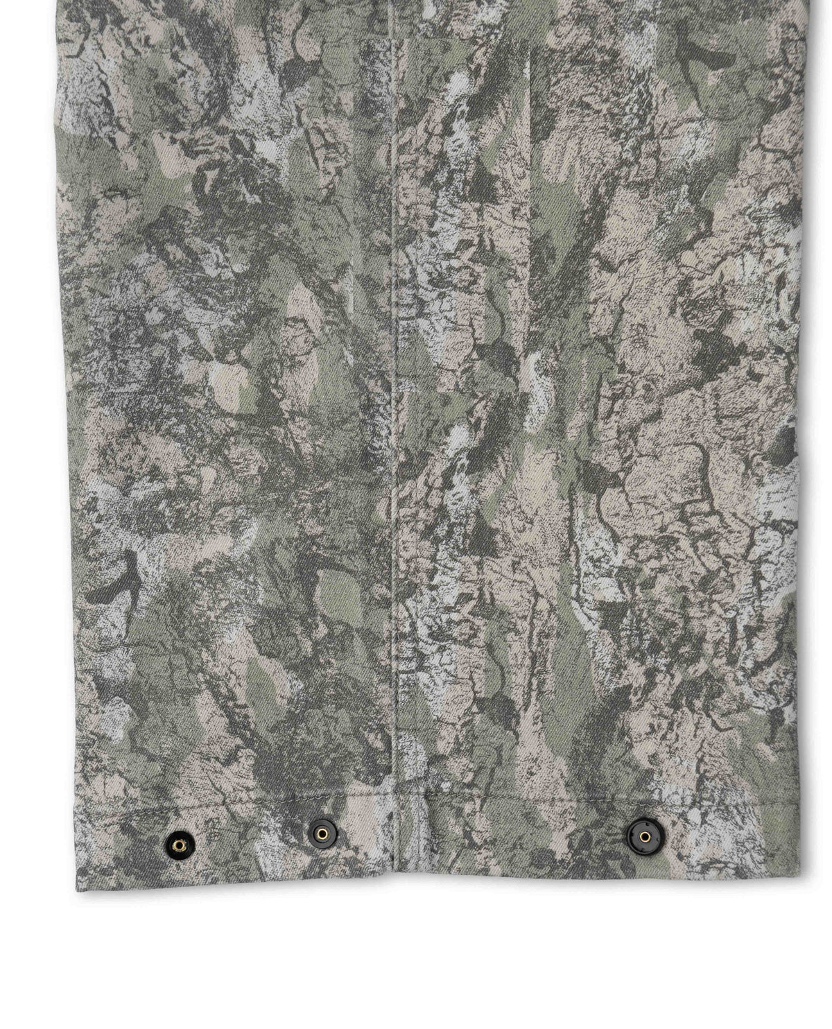Close-up of a camouflage-patterned fabric with a neutral color scheme.
