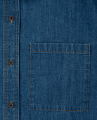 Close-up of a blue denim shirt with a pocket and buttons.