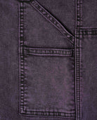 Close-up of a pocket on a dark denim fabric