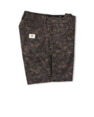Dark camouflage pants with a brand label on a white background